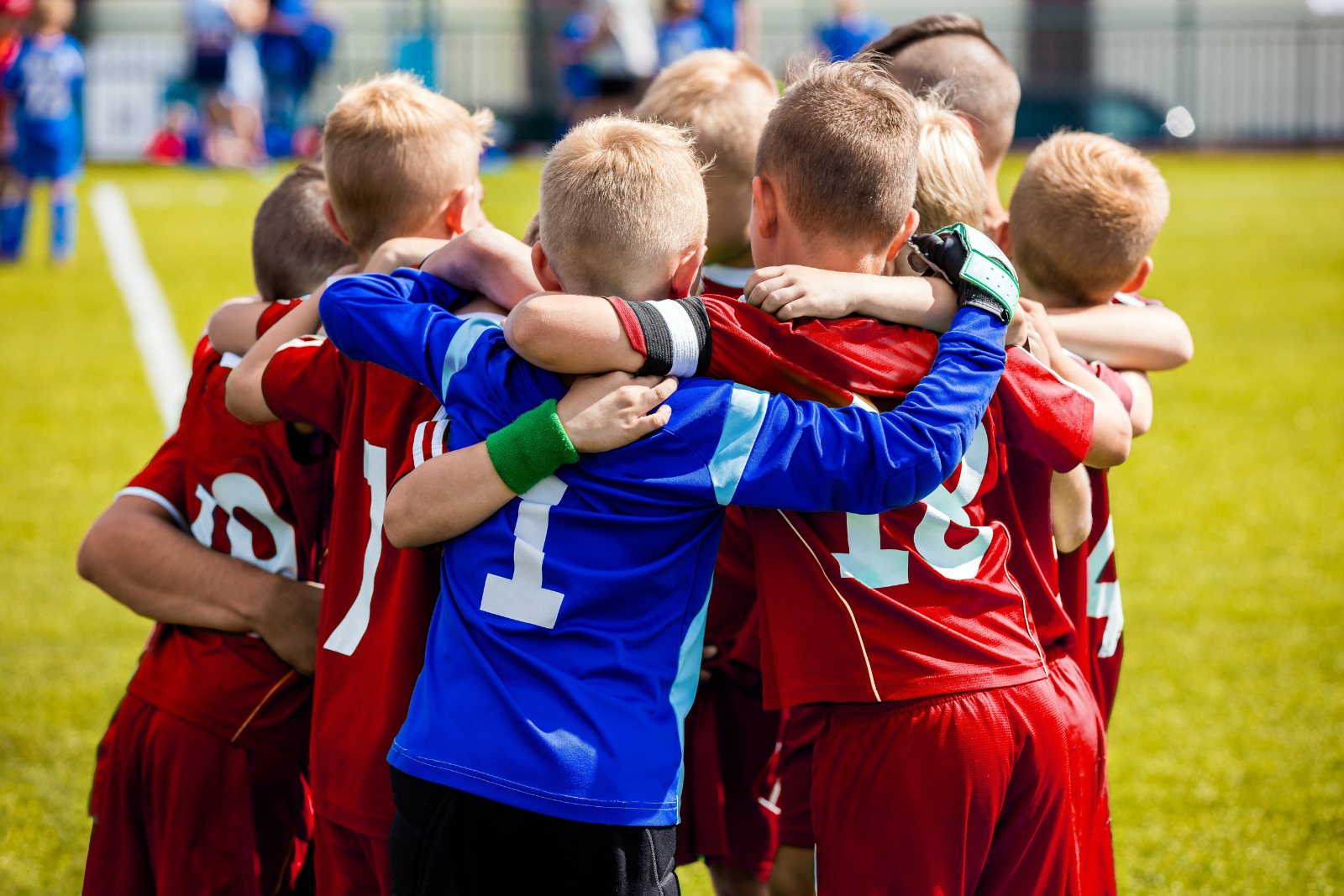 Youth players huddling together